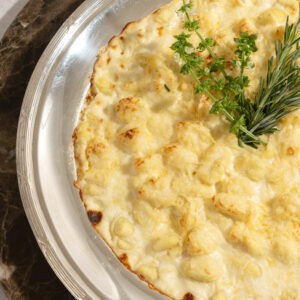 Gnocchi de batata (fonduta de queijo)